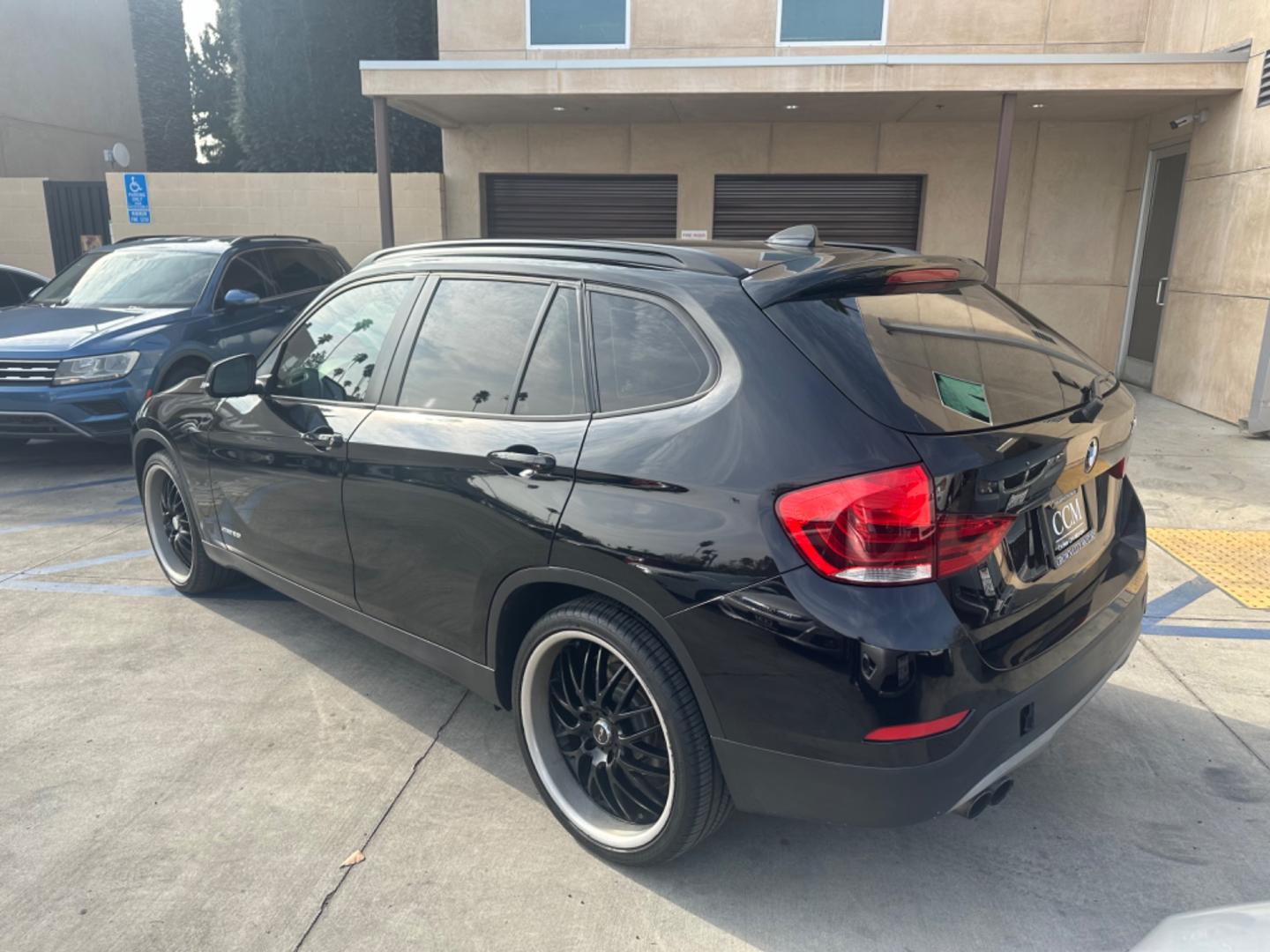 2014 Black /Black BMW X1 (WBAVM1C57EV) with an 4 CYLINDER engine, Automatic transmission, located at 30 S. Berkeley Avenue, Pasadena, CA, 91107, (626) 248-7567, 34.145447, -118.109398 - Photo#3